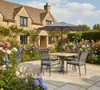 007515-5000c-merano-4-seat-dining-set-with-parasol-base-lifestyle.jpg.jpg