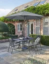 c0601-0200-7c940-t0475-0200s-pw25-930-caredo-6-seater-set-slate-with-parasol-lifestyle.jpg